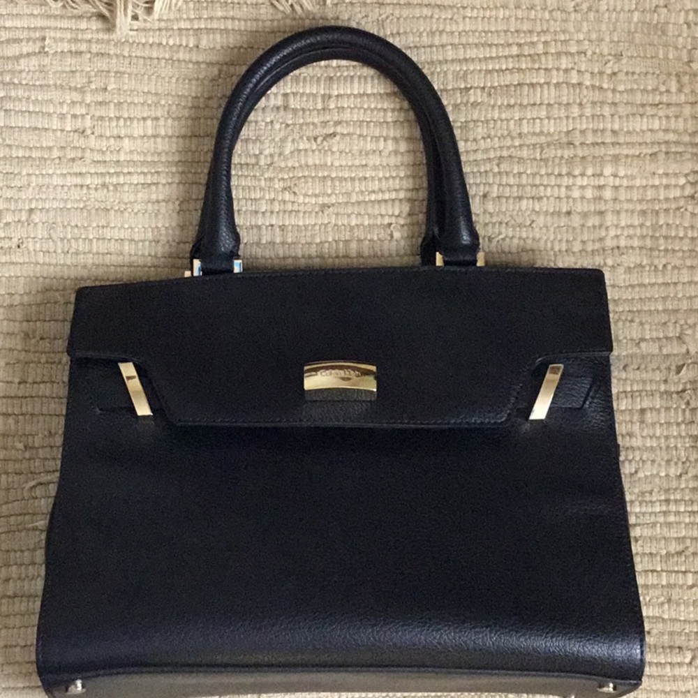 Calvin Klein Brook top handles black pebble leather satchel bag.